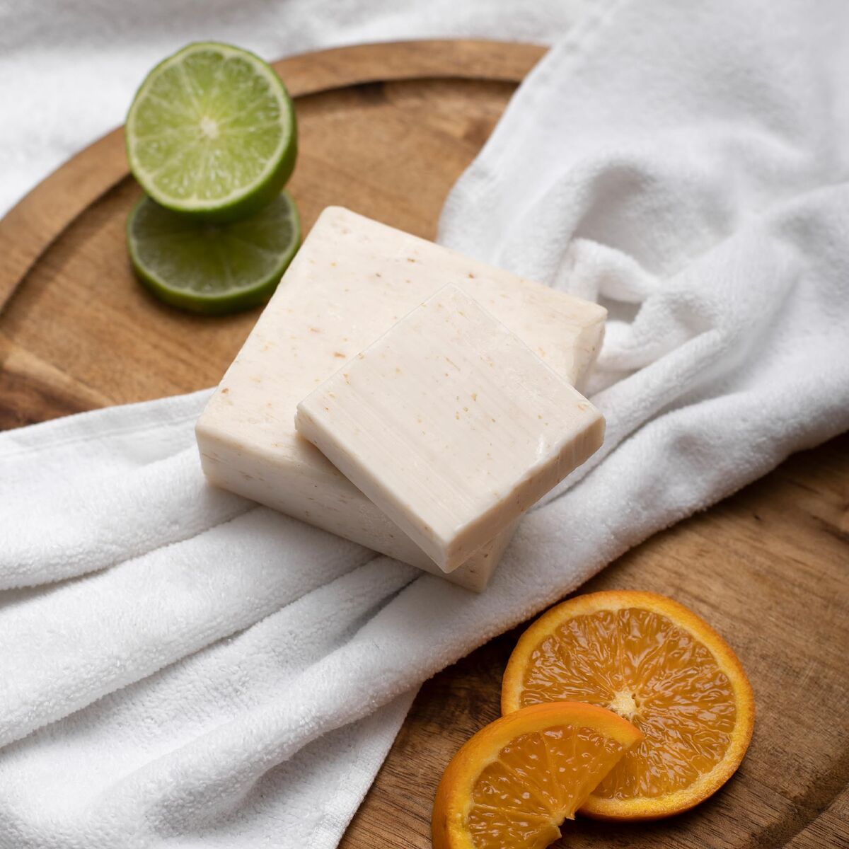 Cedar citrus soap bar with cedar bark and citrus zest on stone