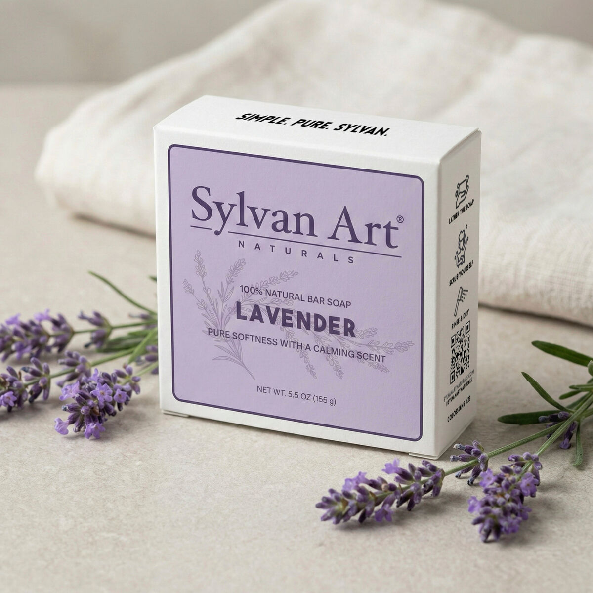 Handcrafted lavender soap bar on natural linen with dried lavender sprigs
